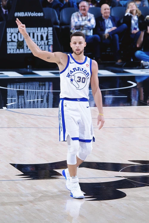 Curry in Classic Basketball Uniform Featuring White and Blue Accents for a Bold and Sporty Look