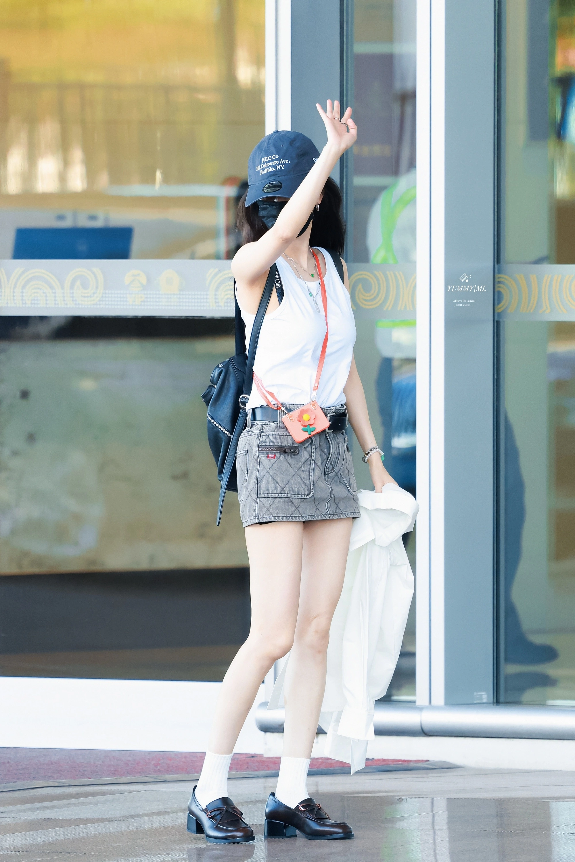Casual Chic Ensemble with Denim Mini Skirt and Accessories for a Trendy Day Out