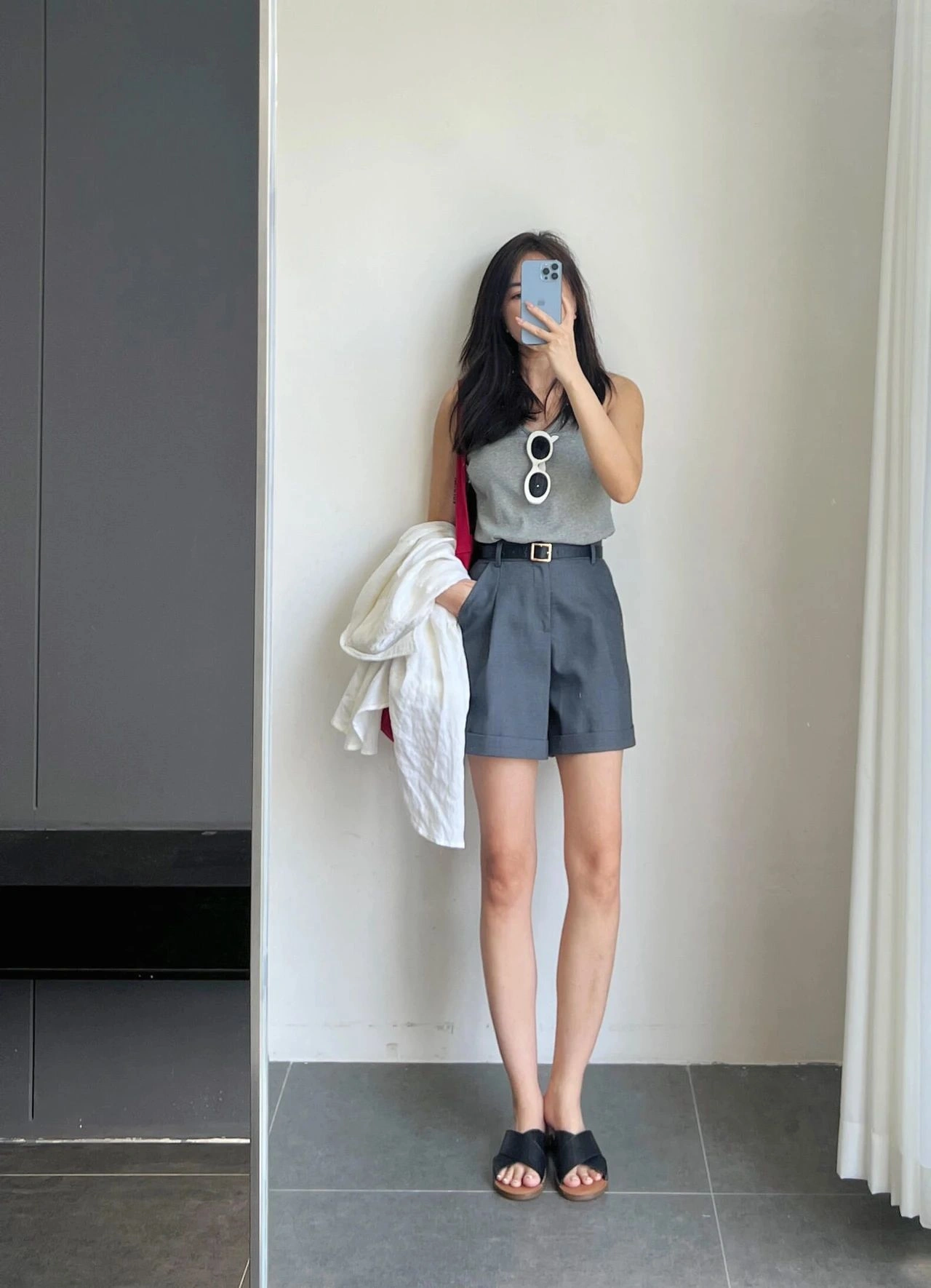 Chic Summer Style: Grey Sleeveless Top with High-Waisted Shorts and Black Sandals