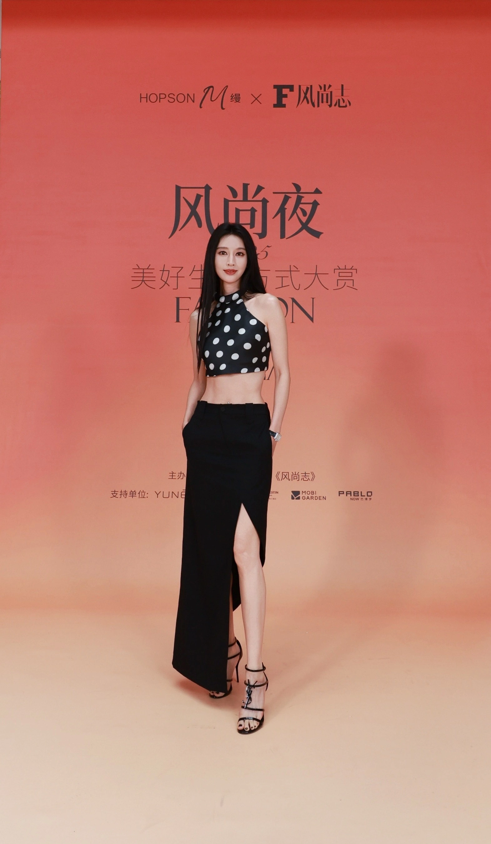 Modern Elegance with a Polka Dot Top and High-Slit Skirt for a Timeless Look