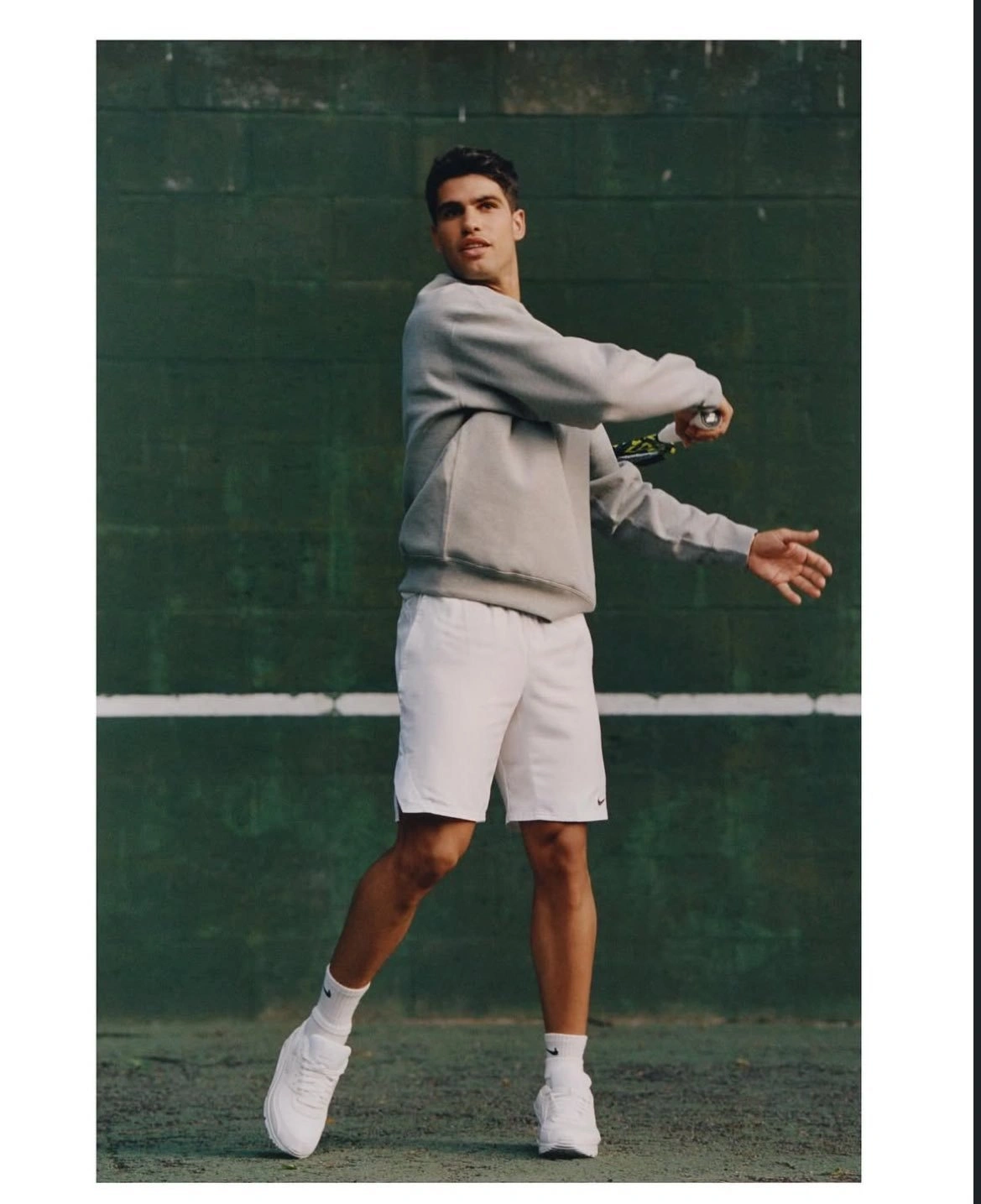 Sporty Elegance with a Light Grey Sweatshirt, White Shorts, and Stylish White Sneakers