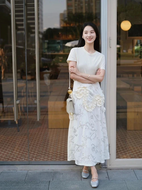 Chic and Elegant: White T-Shirt with Floral Maxi Skirt and Silver Flats