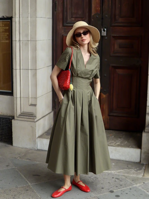 Timeless Olive Green Midi Dress with Red Accents and Chic Straw Hat for a Summer Look