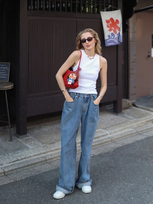 Casual Chic with a Playful Twist: White Tank and Relaxed Jeans with Vibrant Accessories