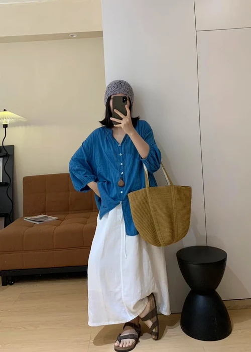 Casual Chic: Blue Button-Down with White Maxi Skirt and Brown Accessories