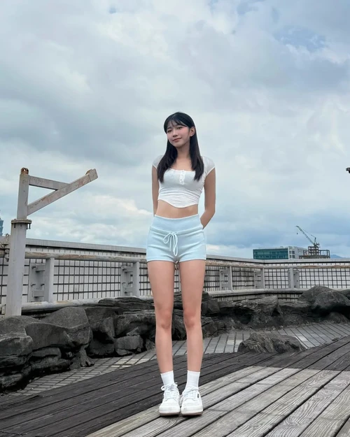 Casual Sporty Look with White Crop Top and Light Blue Shorts