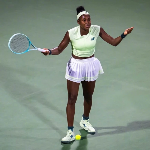 Stylish and Functional Tennis Outfit with Green Crop Top and White Pleated Skirt
