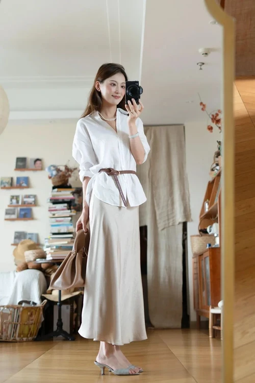 Effortlessly Chic in a White Blouse and Beige Maxi Skirt with Stylish Accessories