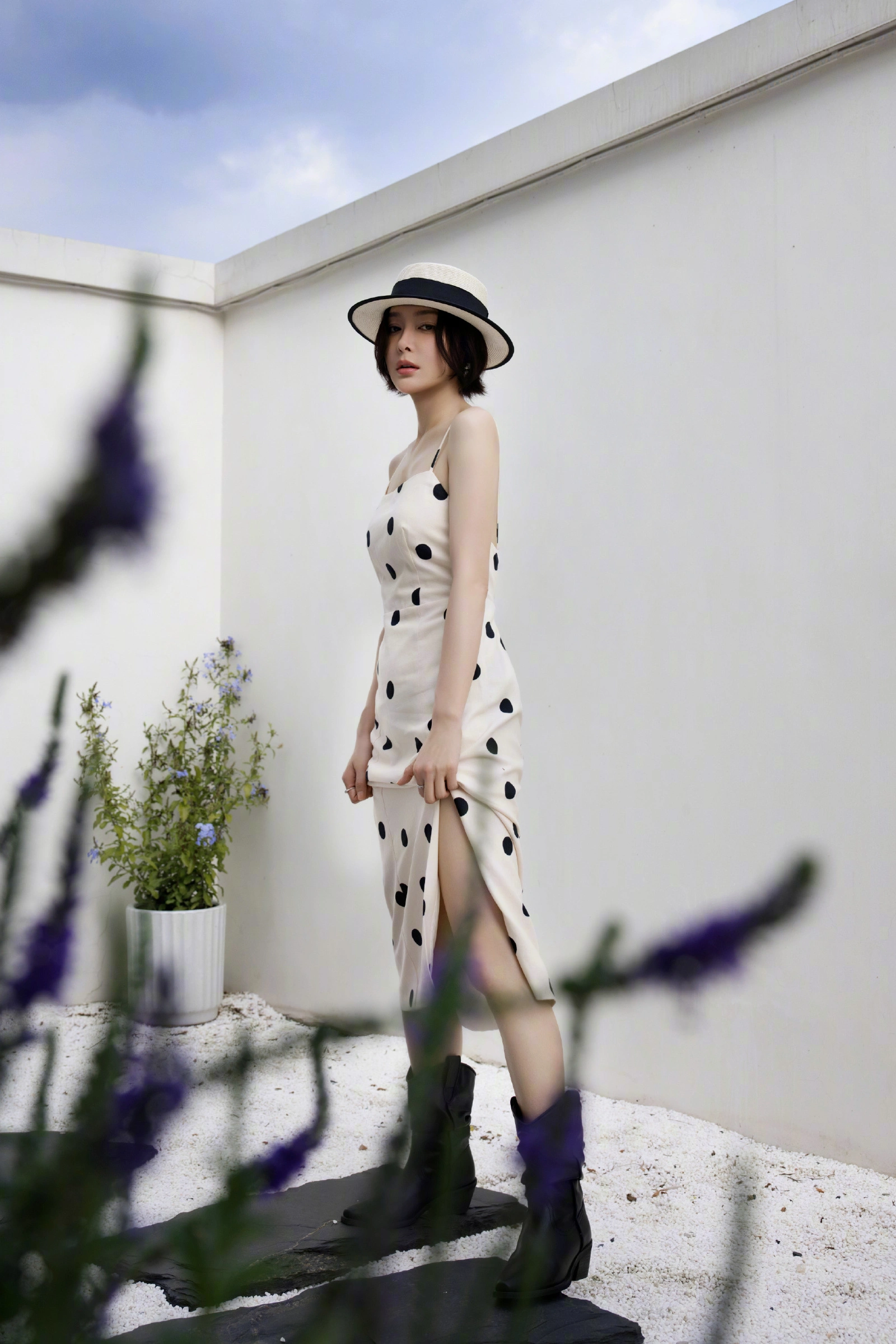 Timeless Elegance: Cream Polka Dot Slip Dress with Vintage Hat and Black Boots