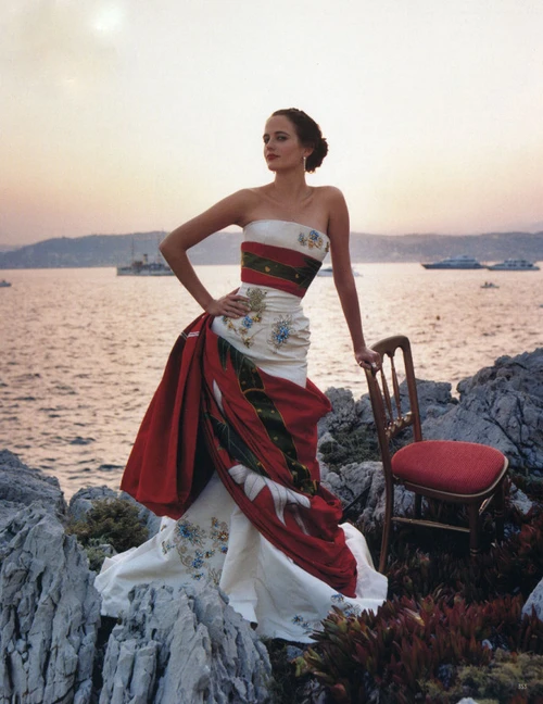 Elegant Strapless Gown with Floral Embroidery and Draped Red Accent