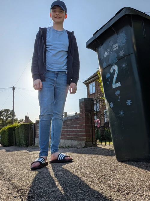 Casual Comfort with Blue Hues: Denim Jeans, Hoodie, and Slides Ensemble