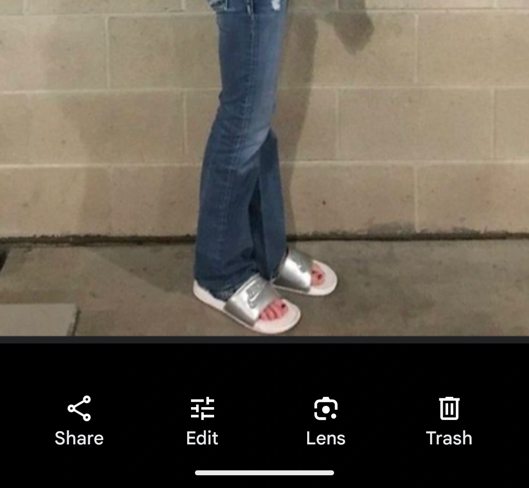Casual Chic with Distressed Jeans and Silver Slide Sandals