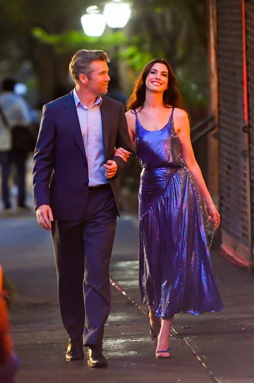 Elegant Evening Look Featuring a Classic Suit and Sequined Blue Gown