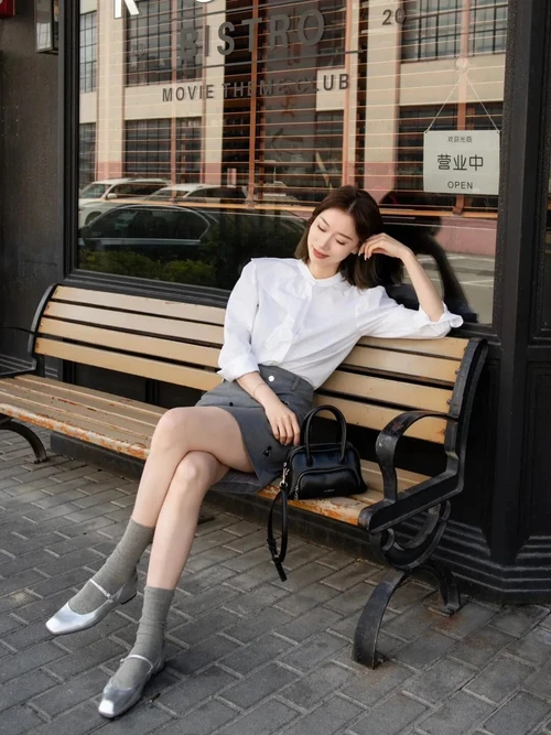 Elegant Combination of White Blouse and Grey Skirt with Silver Heels