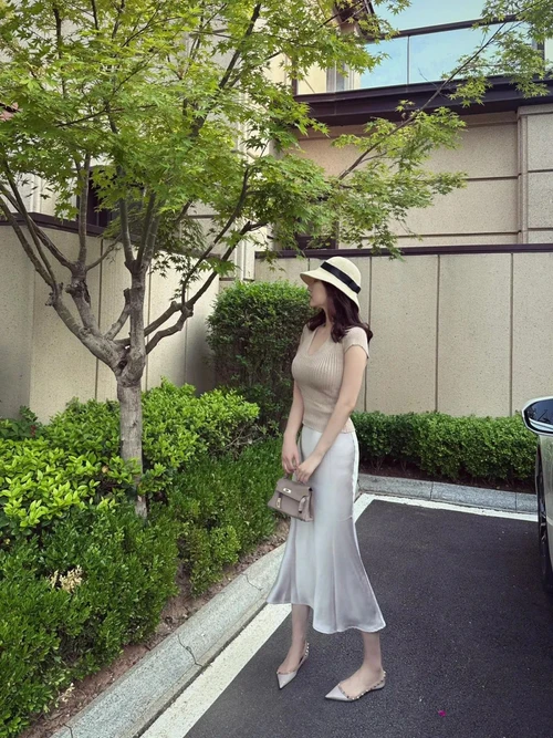 Elegant Neutrals with a Chic Twist: Beige Top and Ivory Midi Skirt with Flats