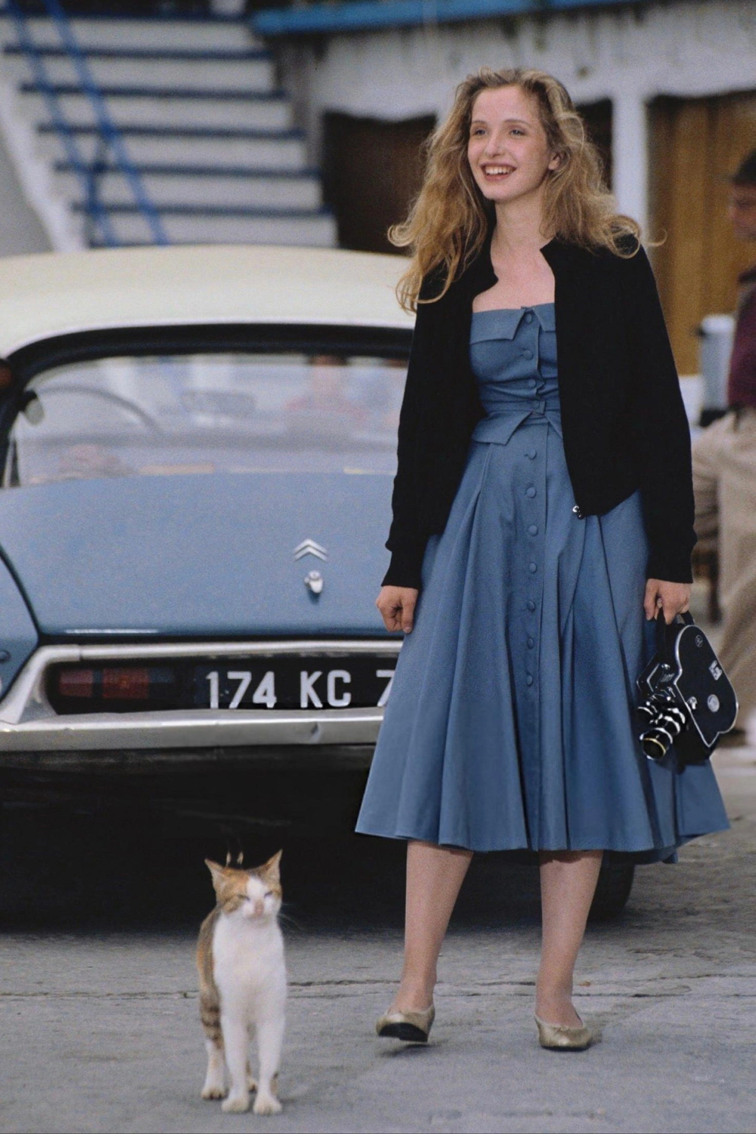 Elegant Blue Midi Dress with Black Cardigan and Timeless Accessories for a Vintage Day Look