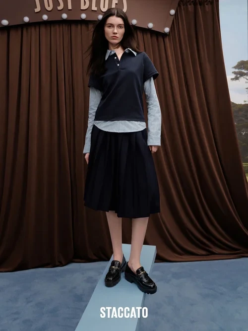 Chic Layered Polo Shirt with Pleated Skirt and Glossy Loafers for a Classic-Modern Mix
