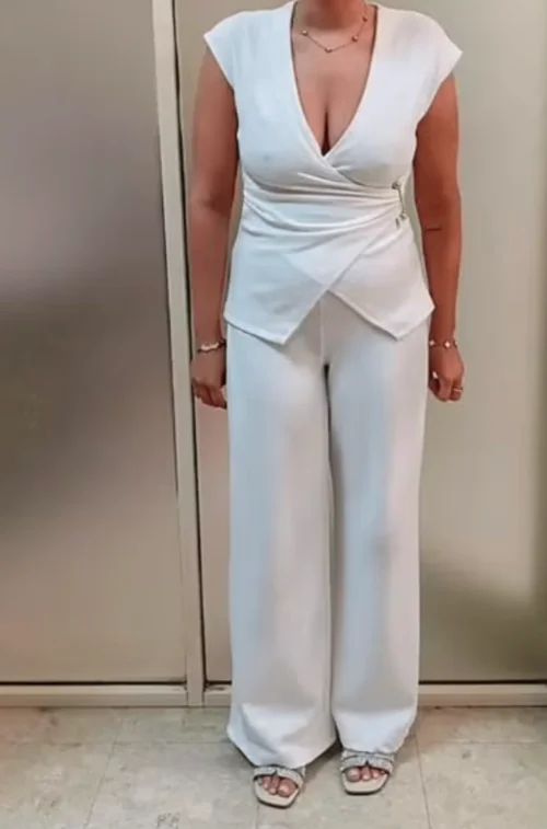 Elegant All-White Ensemble Featuring a Wrap Top and Wide-Legged Pants for a Chic Look