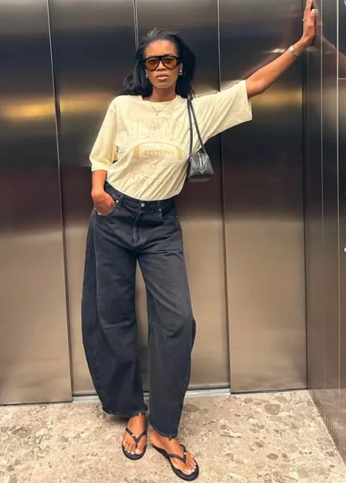 Casual Street Style: Oversized Graphic Tee and Wide-Leg Jeans with Flip-Flops
