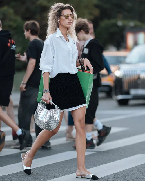 Chic Monochrome Street Style with White Shirt and Black Mini Skirt