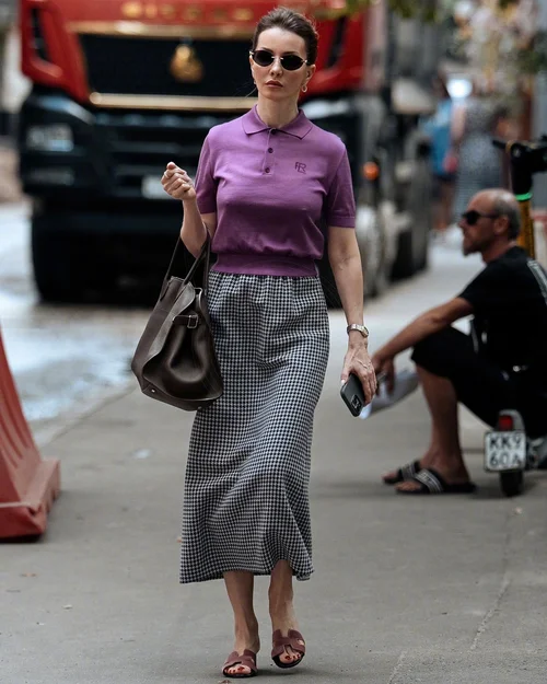 Chic Purple Polo Shirt with Classic Houndstooth Skirt and Stylish Accessories