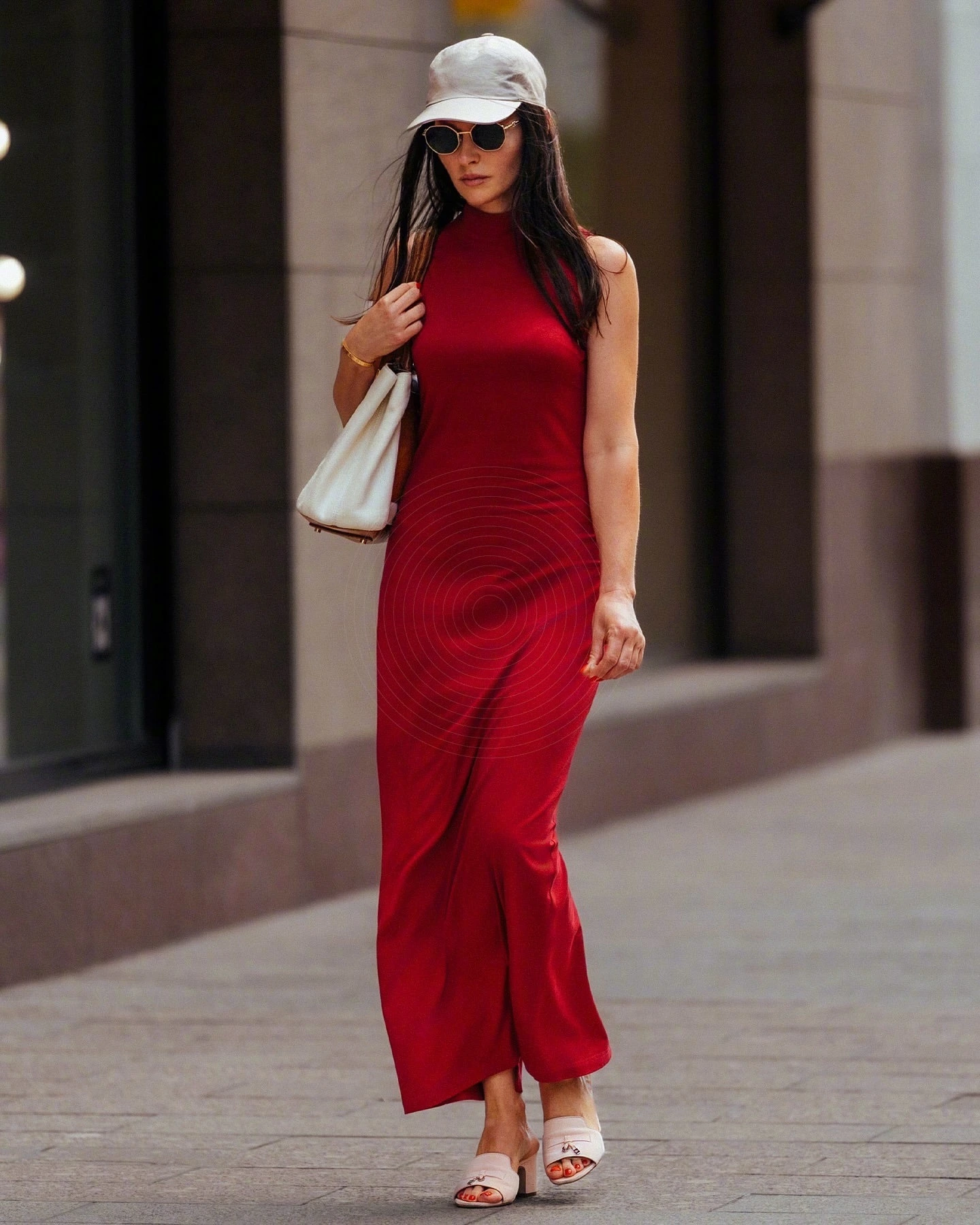 Elegant Red Dress with Casual White Accessories and Sporty Cap for a Chic Day Out
