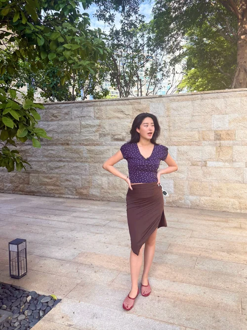 Chic Purple Top and Brown Asymmetrical Skirt Paired with Bold Red Flats