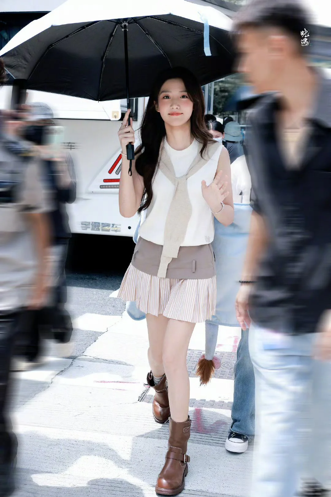 Preppy Casual Look with Sleeveless Top, Pleated Skirt, and Brown Boots