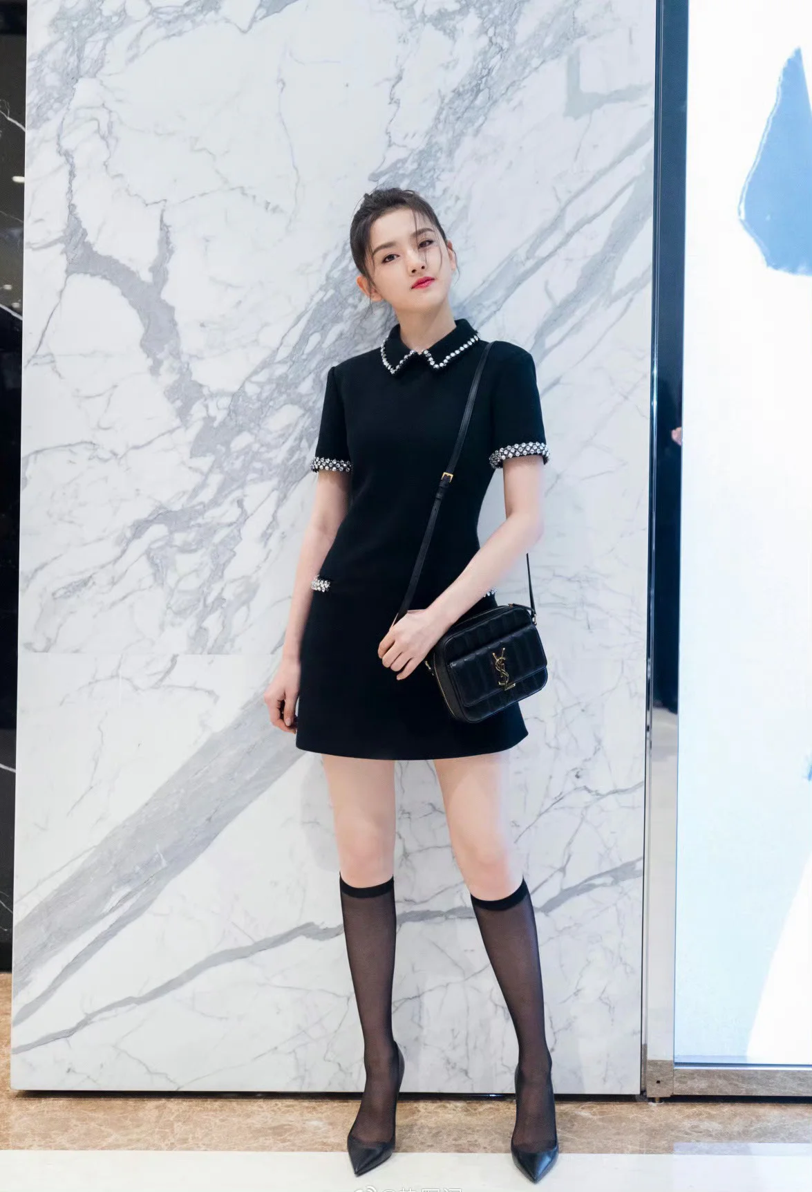 Chic Black Mini Dress with Embellished Collar and Sophisticated Accessories