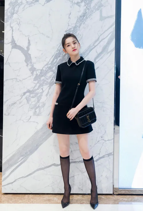 Chic Black Mini Dress with Embellished Collar and Sophisticated Accessories