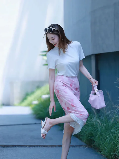 Summer Chic: White Tee with Pink Ruffle Midi Skirt and Coordinated Accessories