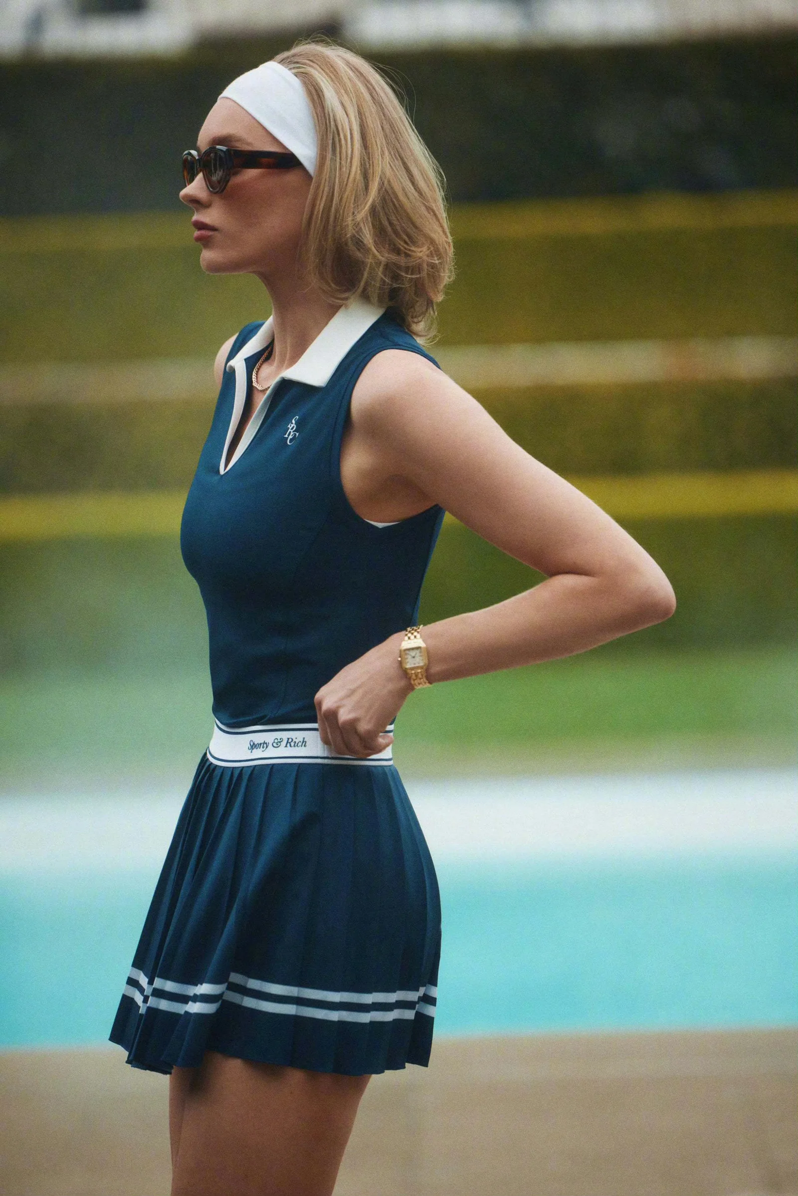 Navy Tennis Chic: Sporty Dress with Retro Accents and Pleats
