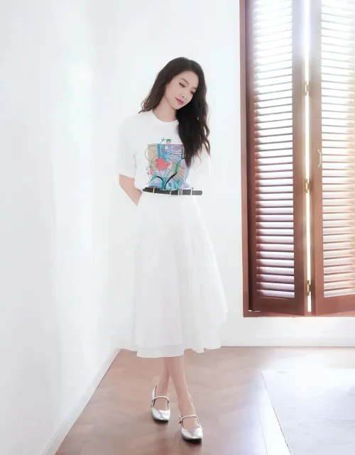 Minimalist Elegance: White Graphic Tee and Midi Skirt with Silver Accents