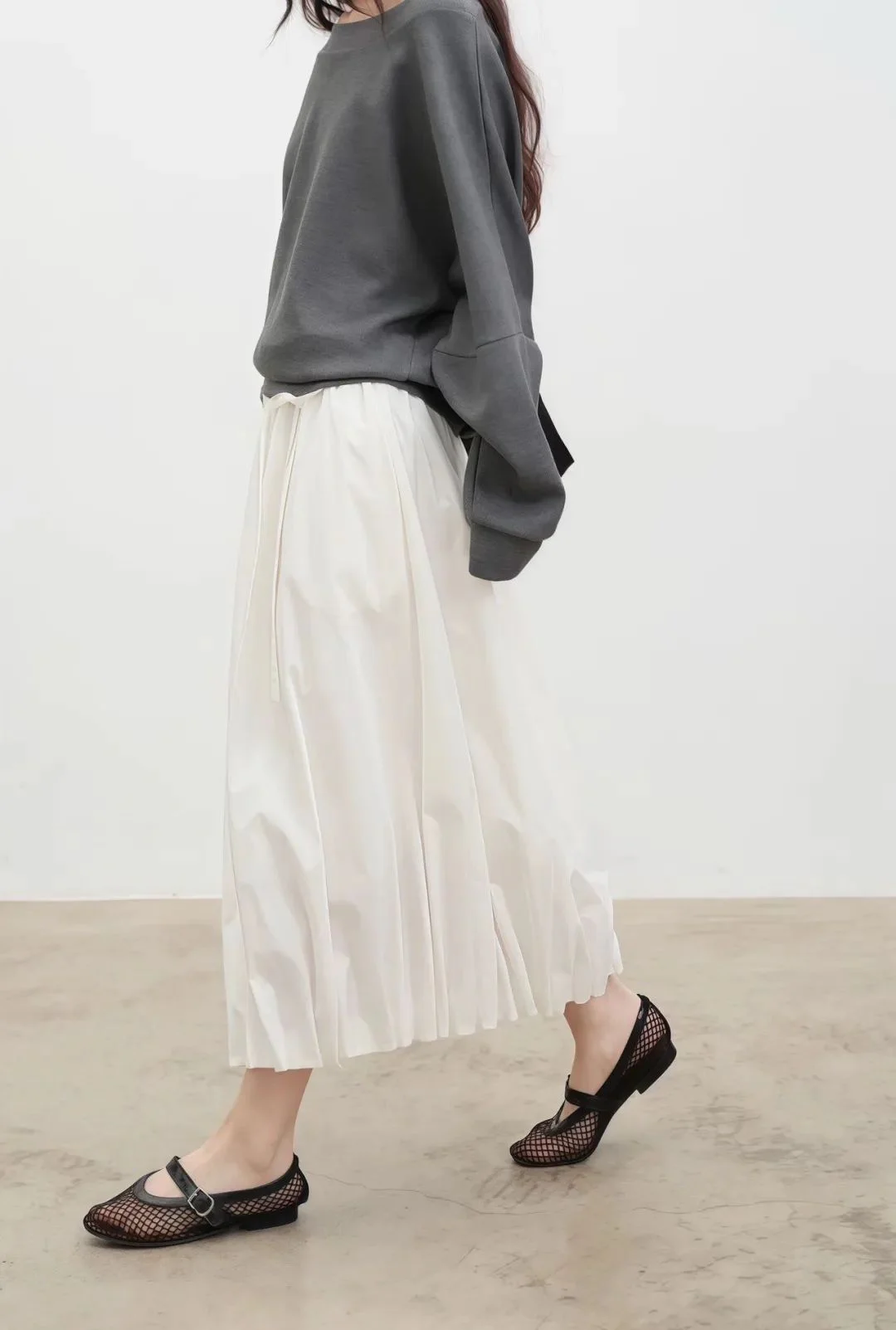 Effortlessly Chic: Grey Sweatshirt and White Midi Skirt Ensemble