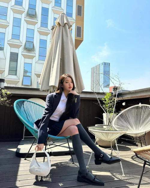 Chic Preppy Style with Navy Blazer, White Shirt, and Mini-Skirt