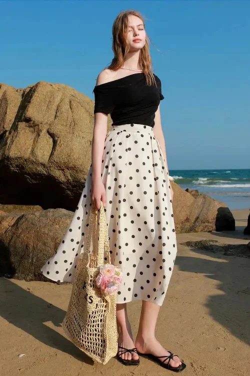 Chic Beach Look with Black Off-Shoulder Top and Polka-Dot Skirt