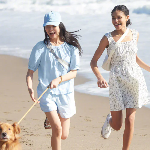 Stylish Beach Day in Light Blue Ensemble and White Summer Dress with Sneakers