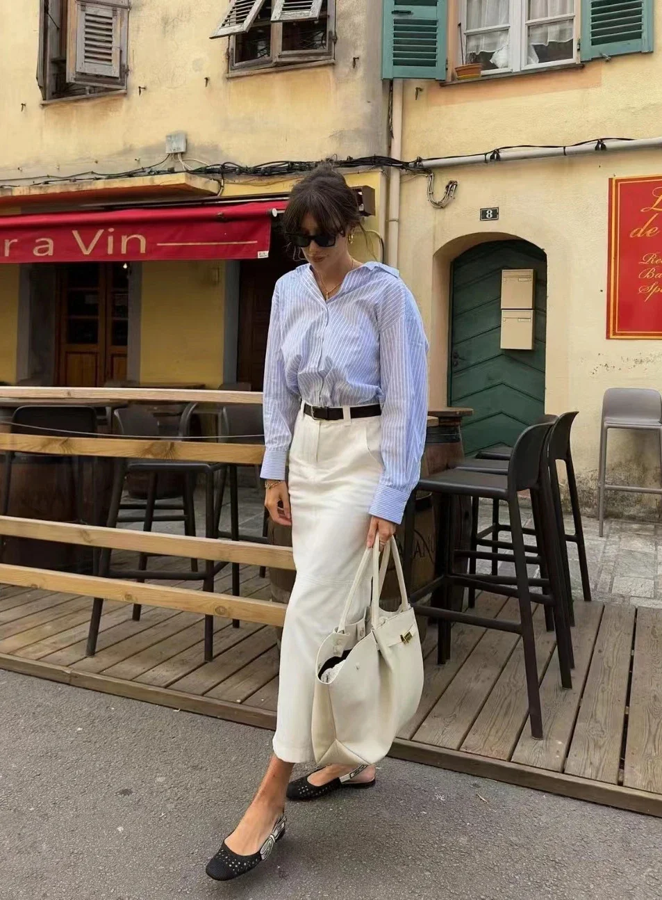 Effortlessly Chic: Light Blue Striped Shirt and White Skirt Ensemble with Black Accents