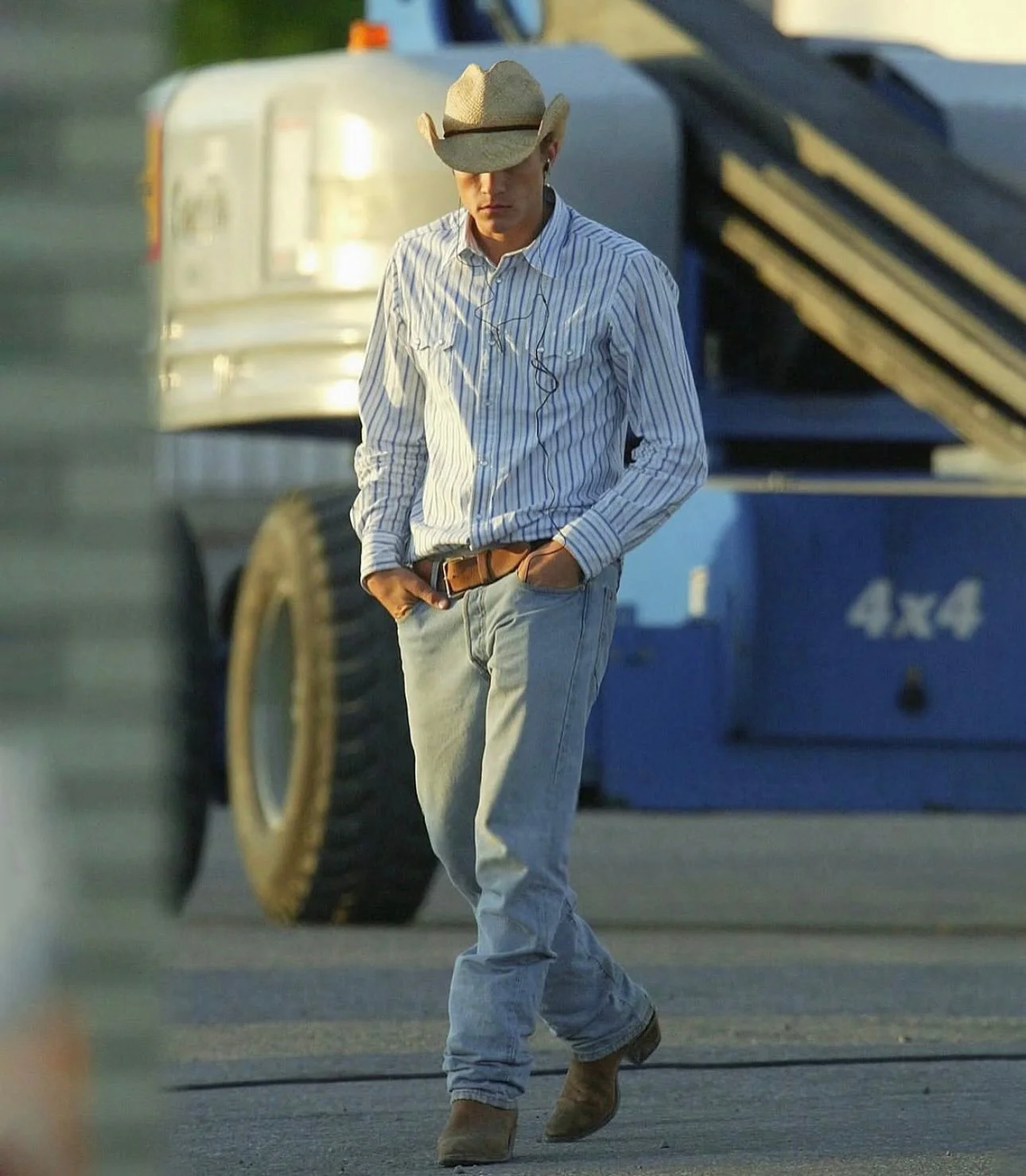 Classic Western Style with Striped Shirt, Light Wash Jeans, and Cowboy Accessories