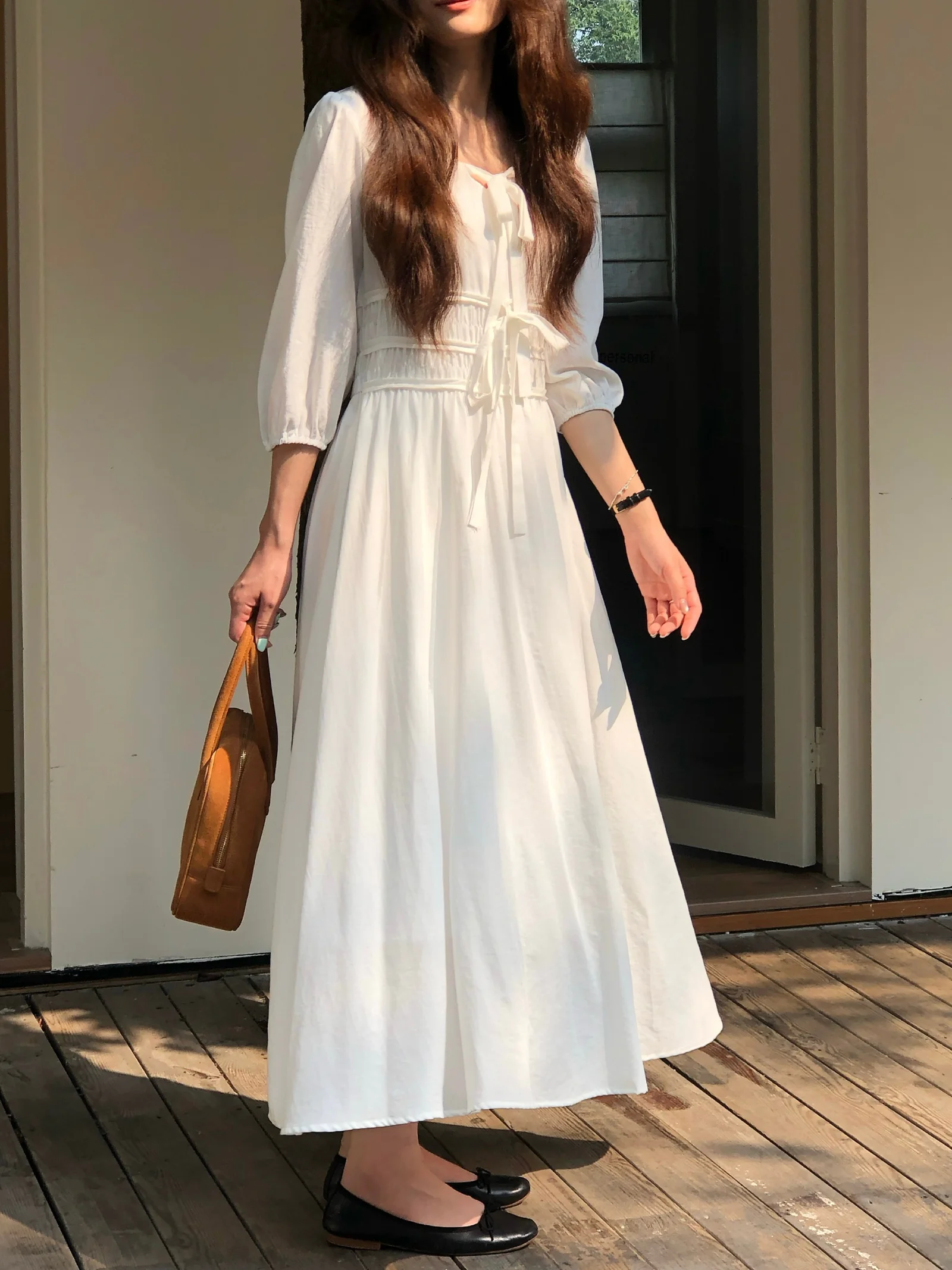 Effortless Elegance: White Maxi Dress with Puff Sleeves and Accessories