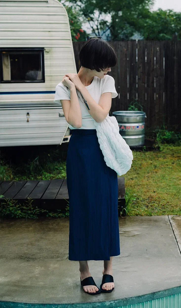 Minimalist Style with White Tee and Navy Midi Skirt for Casual Elegance