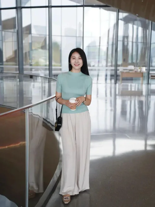 Chic Pastel and Beige Ensemble with a Black Crossbody Bag for Effortless Style