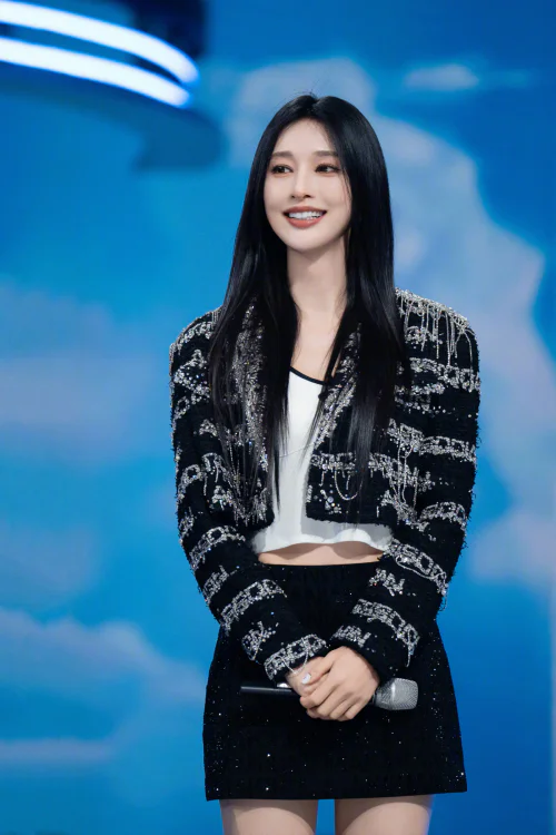Elegant Black and White Outfit with Embellished Jacket and Mini Skirt