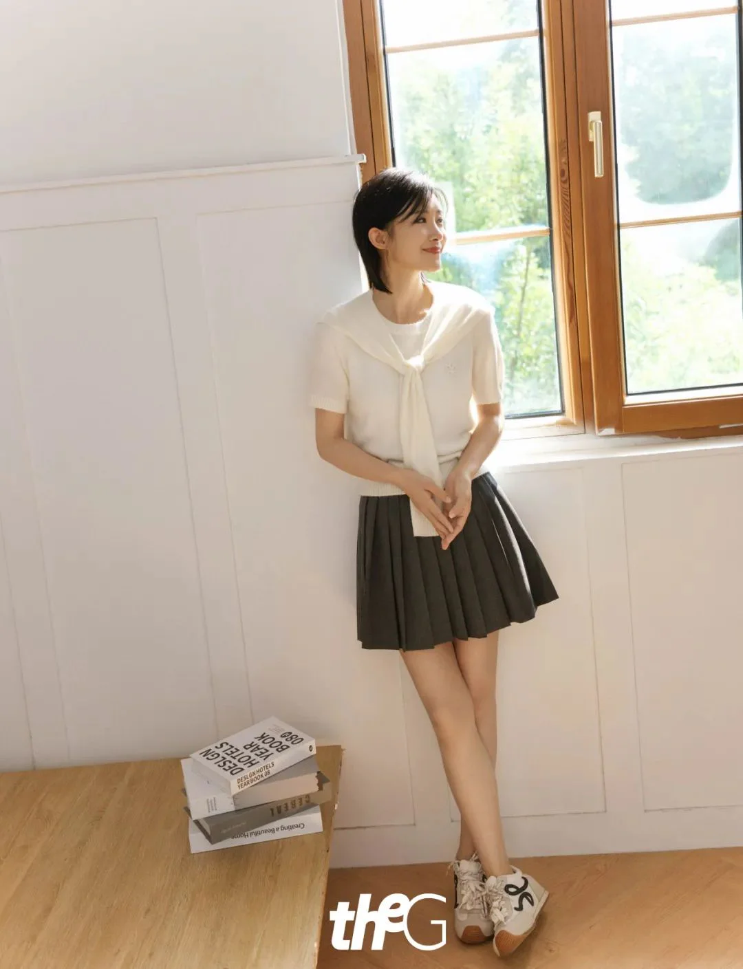 Classic White Top and Pleated Skirt with Sporty Sneakers for a Fresh Look