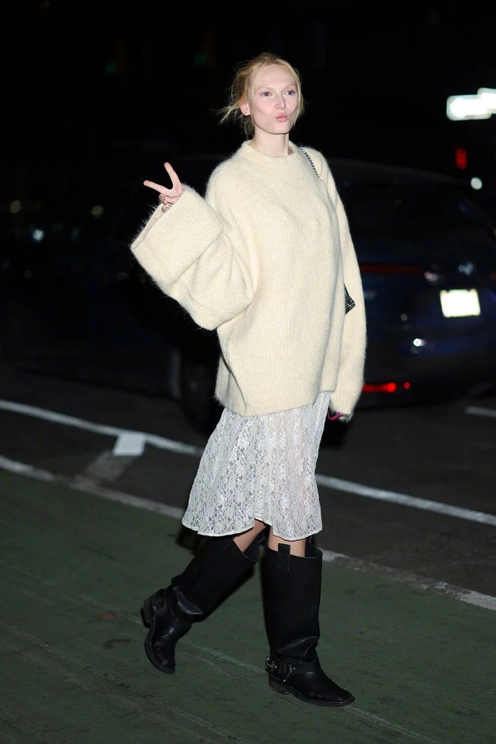 Cozy Chic: Oversized Cream Sweater and Lace Skirt with Black Boots