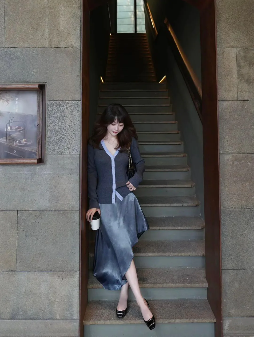Elegant Dark Cardigan and Gradient Asymmetrical Skirt with Black Flats