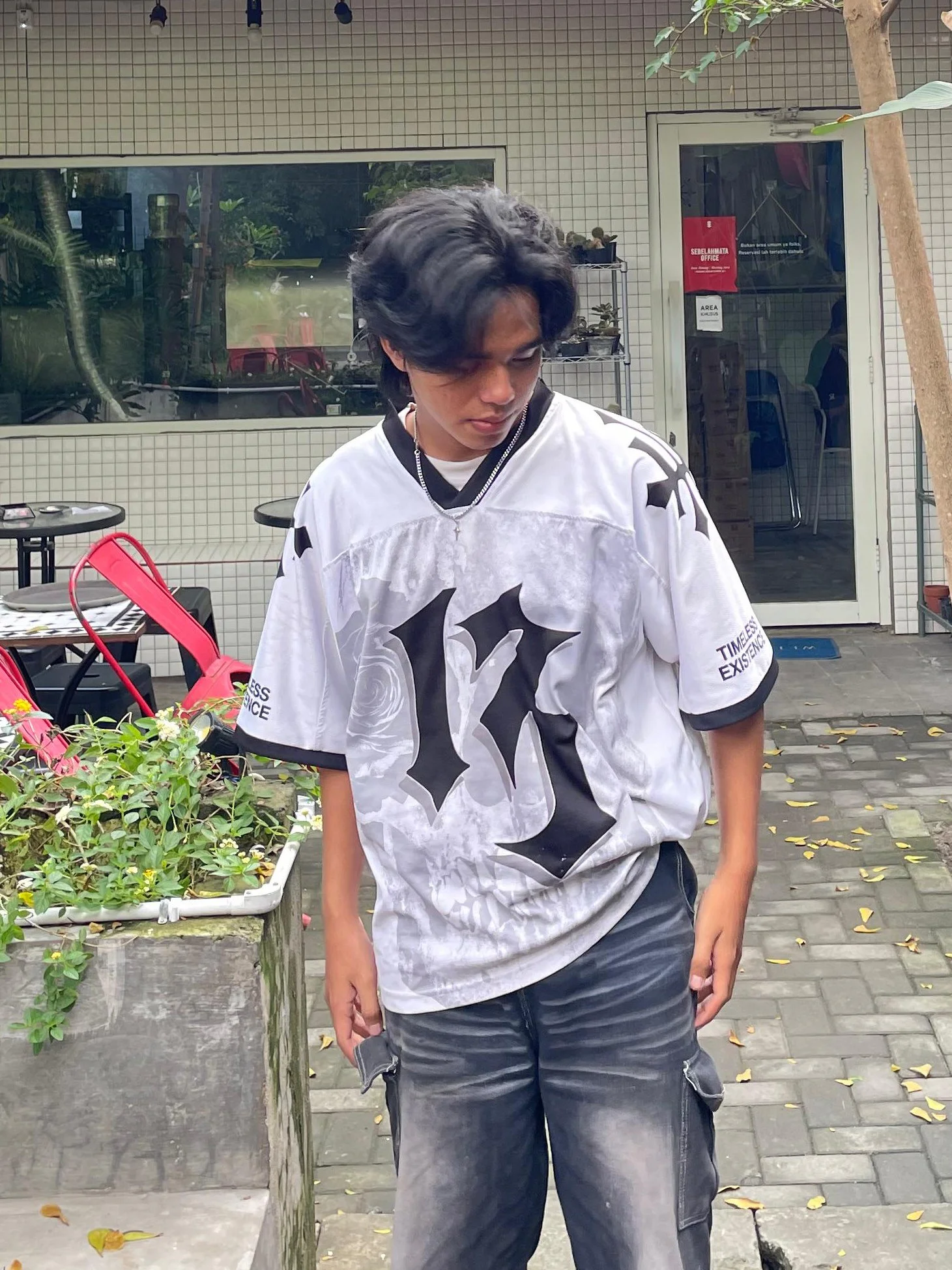 Edgy Monochrome Streetwear Outfit Featuring Bold Graphic Jersey