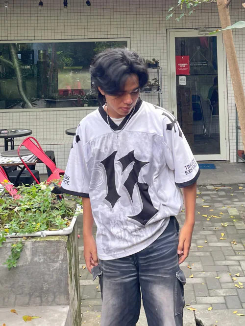 Edgy Monochrome Streetwear Outfit Featuring Bold Graphic Jersey