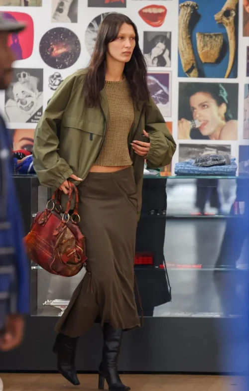 #Bella Hadid Outfit# Chic Earthy Tones with Olive Jacket, Brown Midi Skirt, and Black Boots