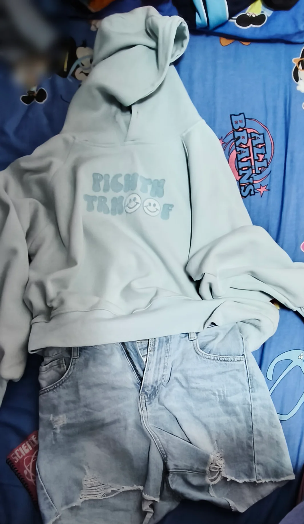 Casual Comfort: Oversized Hoodie with Distressed Denim Shorts